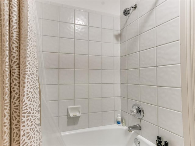 bathroom featuring shower / bath combo with shower curtain