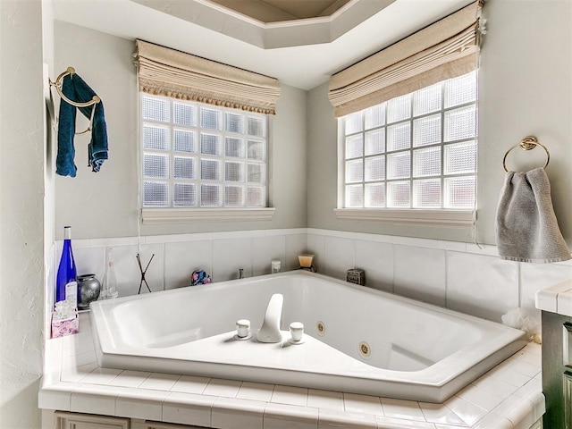 bathroom featuring a relaxing tiled tub