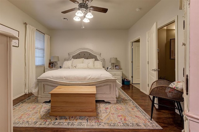 bedroom featuring ceiling fan and dark hardwood / wood-style flooring