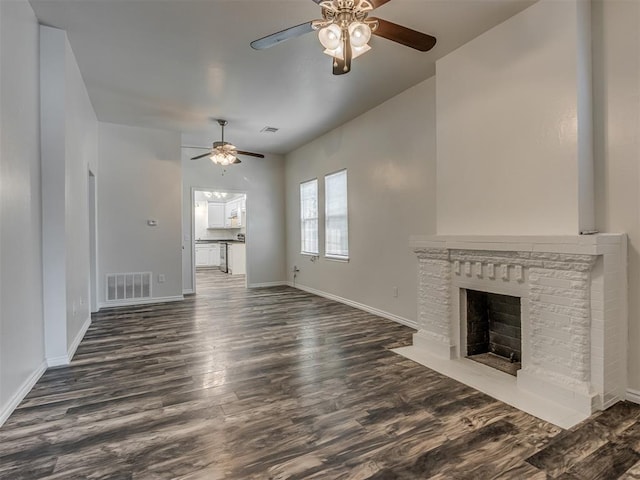 unfurnished living room with ceiling fan and dark hardwood / wood-style flooring