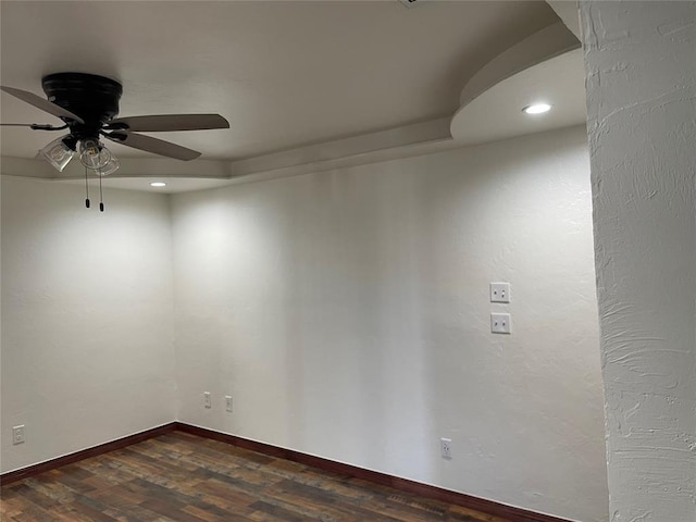 unfurnished room with a ceiling fan, baseboards, dark wood-style flooring, and recessed lighting