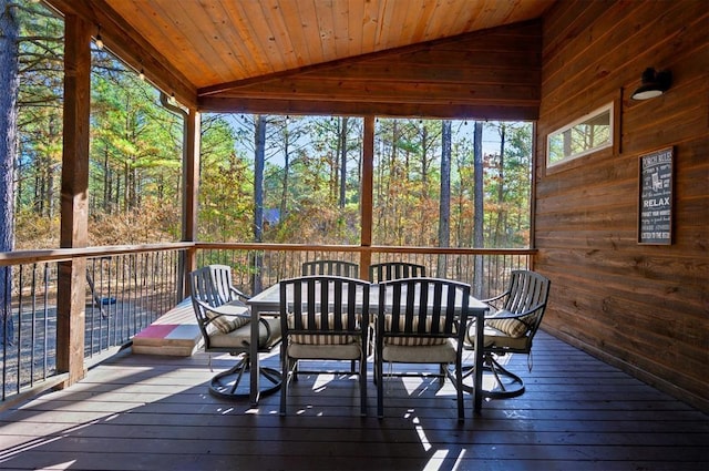 sunroom with lofted ceiling and wooden ceiling