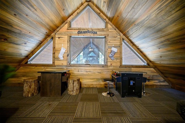 additional living space with lofted ceiling, wooden walls, and wood ceiling