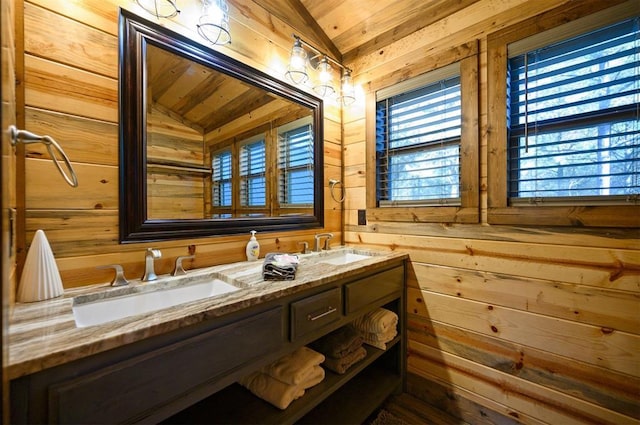 bathroom with wood ceiling, vanity, lofted ceiling, and wooden walls