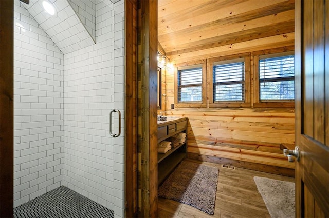 607 Sugar Pine Loop, Broken Bow, OK 74728 - full bath featuring wood finished floors, vanity, a shower stall, healthy amount of natural light, and lofted ceiling