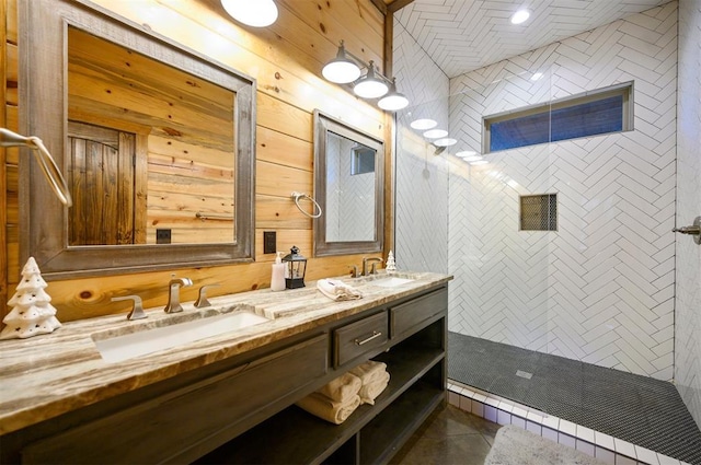 607 Sugar Pine Loop, Broken Bow, OK 74728 - full bath featuring double vanity, a tile shower, wood walls, and tile patterned floors