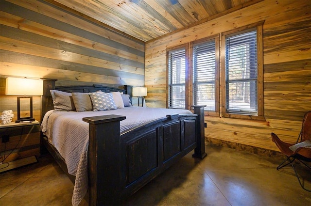 607 Sugar Pine Loop, Broken Bow, OK 74728 - bedroom featuring wood walls, wooden ceiling, concrete flooring, and baseboards