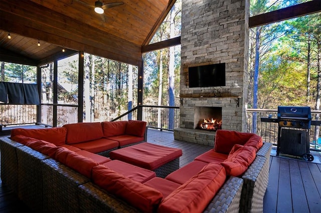 607 Sugar Pine Loop, Broken Bow, OK 74728 - sunroom with an outdoor living space with a fireplace, lofted ceiling, and ceiling fan