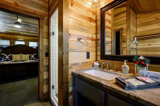 607 Sugar Pine Loop, Broken Bow, OK 74728 - bathroom featuring wooden walls, vanity, and tile patterned floors