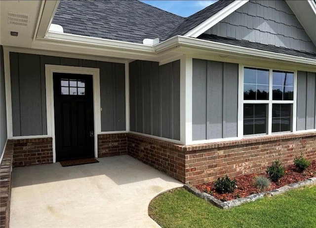 4523 Red Bird Rd, Shawnee, OK 74804 - entrance to property featuring brick siding, board and batten siding, and roof with shingles