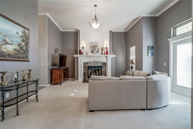 living room with a premium fireplace, ornamental molding, a healthy amount of sunlight, and light carpet