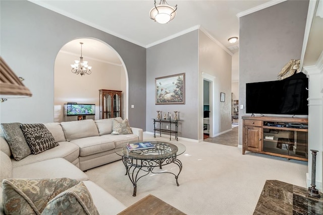 living room with crown molding, carpet, a chandelier, and a high ceiling