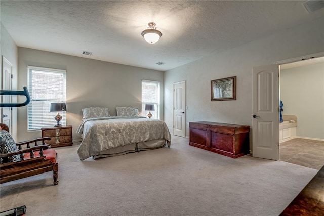 carpeted bedroom featuring multiple windows and a textured ceiling