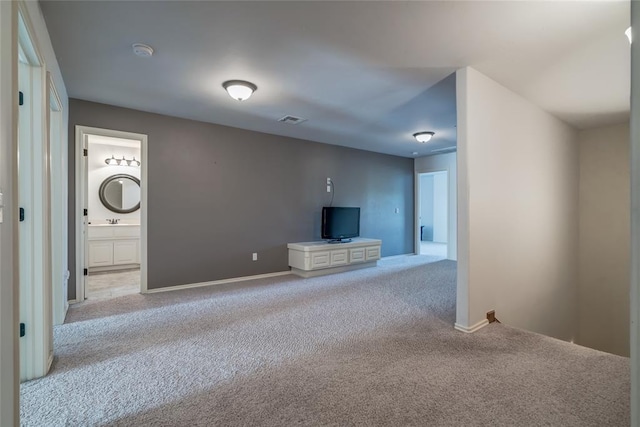 unfurnished living room with light carpet