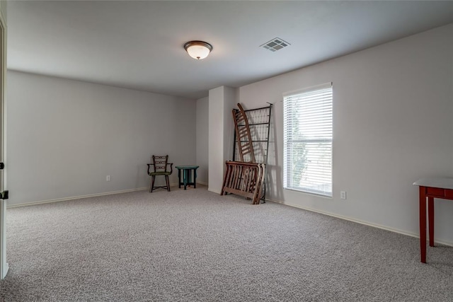 unfurnished room featuring carpet