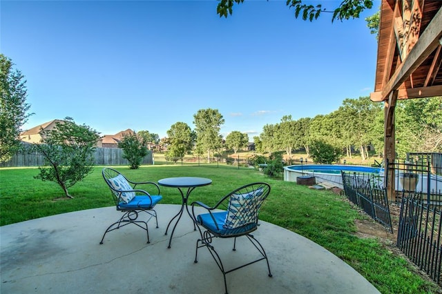 view of patio / terrace featuring a fenced in pool