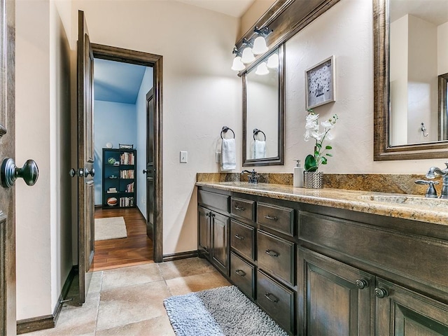 bathroom with vanity and tile patterned floors