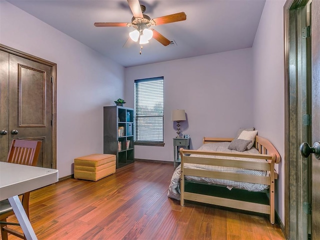 bedroom featuring hardwood / wood-style flooring and ceiling fan