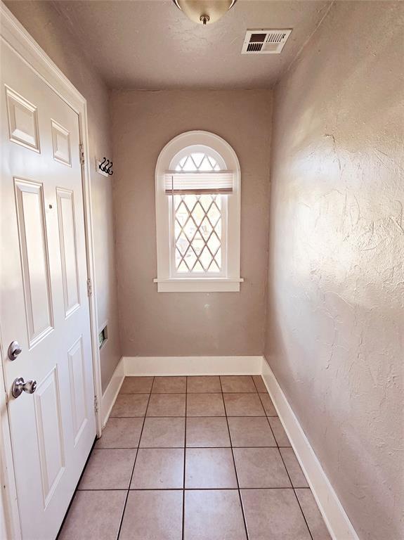 interior space with light tile patterned floors