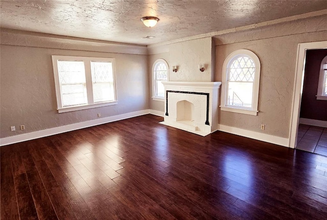 unfurnished living room with dark hardwood / wood-style floors