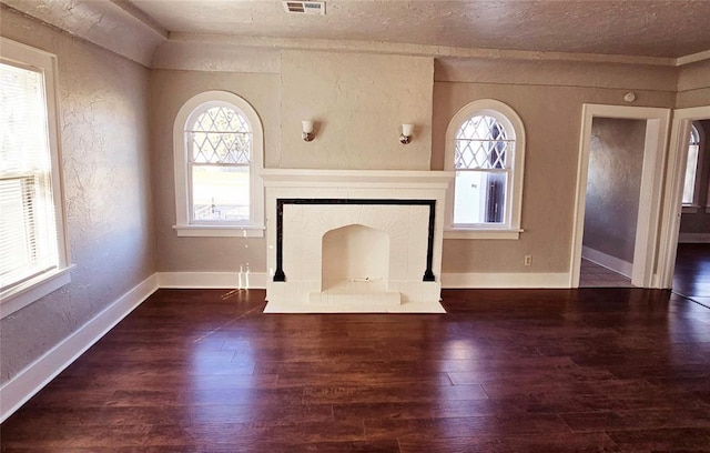 unfurnished living room with dark wood-type flooring