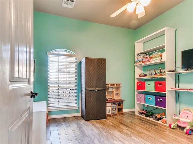 game room featuring hardwood / wood-style flooring and ceiling fan