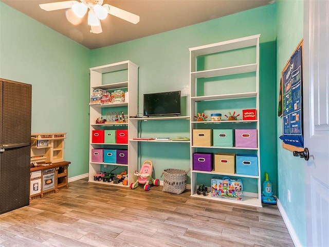 game room featuring hardwood / wood-style floors and ceiling fan