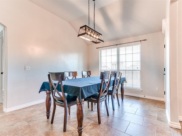 dining area featuring lofted ceiling