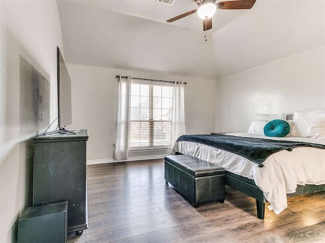 bedroom with ceiling fan, high vaulted ceiling, and dark wood-type flooring