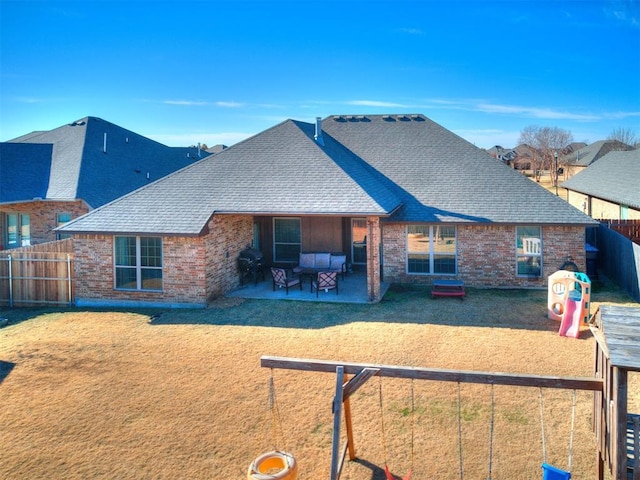 rear view of property featuring outdoor lounge area and a patio area