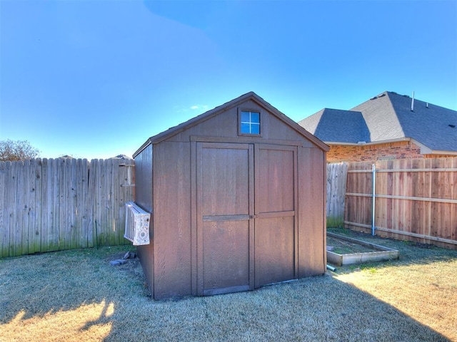 view of outdoor structure with a lawn