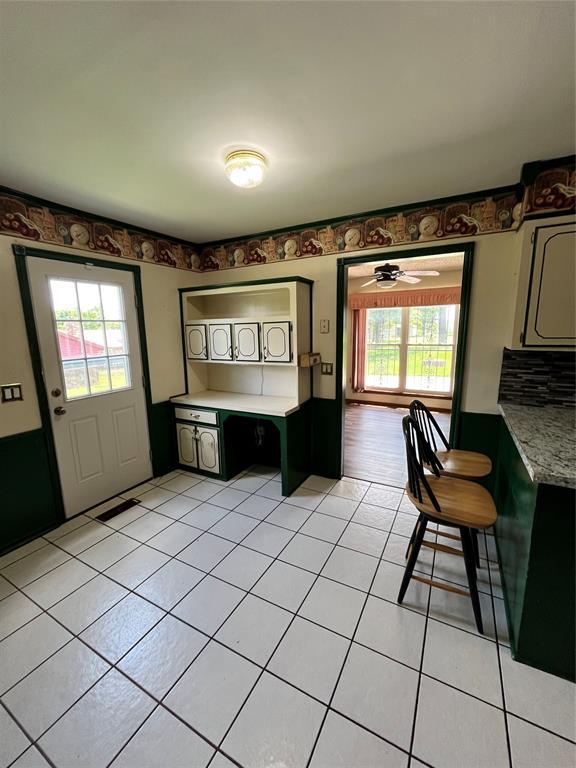 15268 Pheasant Run, Choctaw, OK 73020 - dining space featuring light tile patterned flooring and ceiling fan
