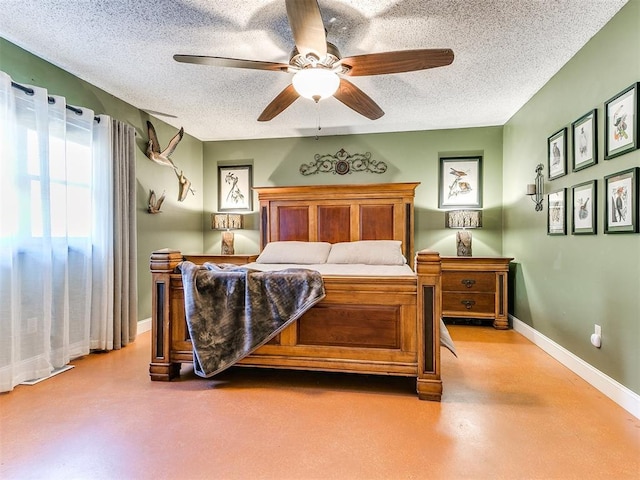 bedroom featuring concrete flooring, a textured ceiling, and ceiling fan