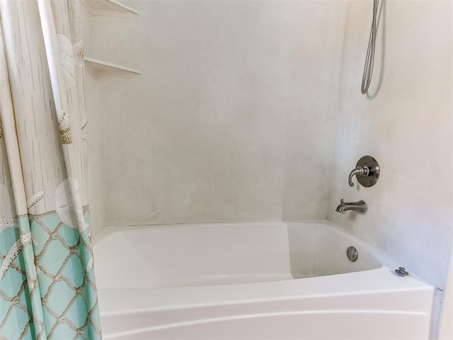 bathroom featuring shower / bath combination with curtain