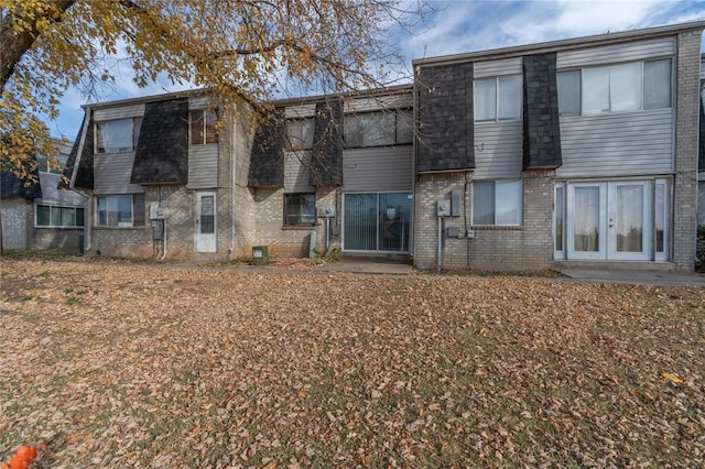 rear view of property with french doors