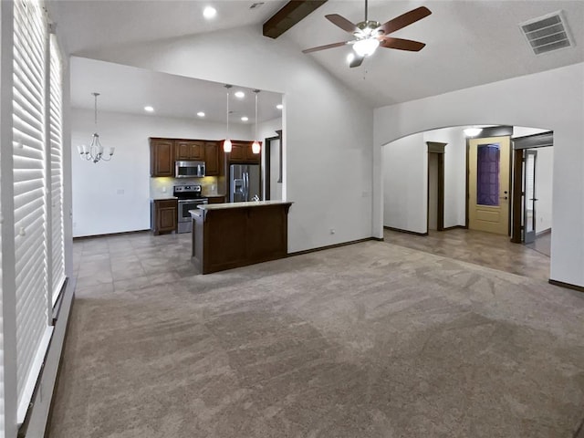 unfurnished living room featuring beamed ceiling, ceiling fan with notable chandelier, light colored carpet, and high vaulted ceiling