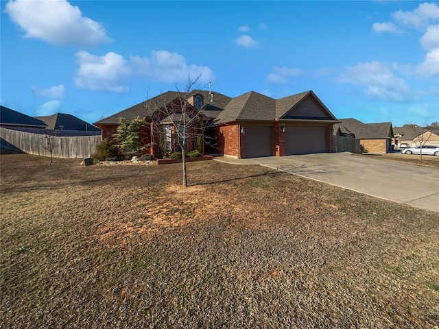 view of front of home with a garage and a front yard