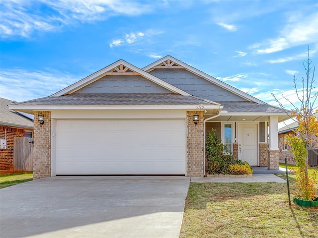 view of front of home with a garage and a front lawn