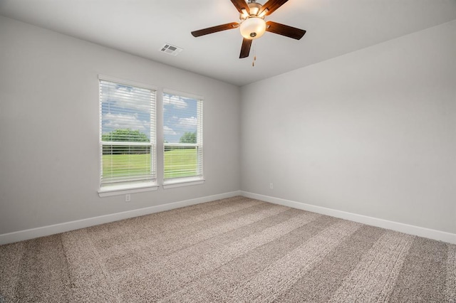 carpeted empty room with ceiling fan