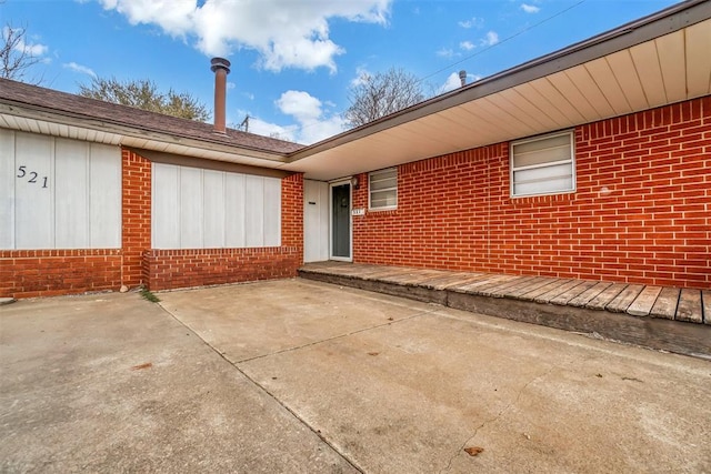 property entrance with a patio area