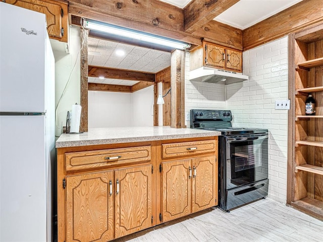 kitchen with black electric range oven, beamed ceiling, and white fridge