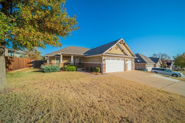 single story home featuring a front yard and a garage