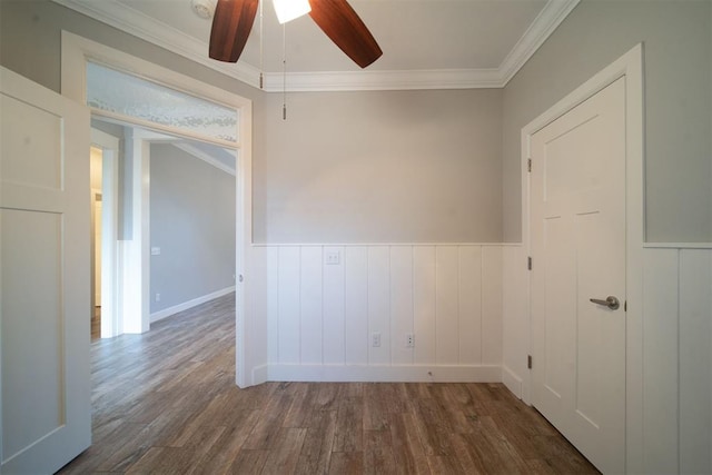 unfurnished room with crown molding, dark hardwood / wood-style flooring, and ceiling fan