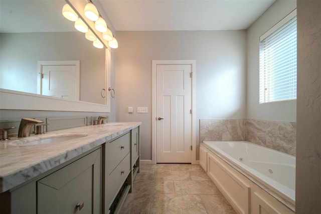 bathroom with vanity and a bath