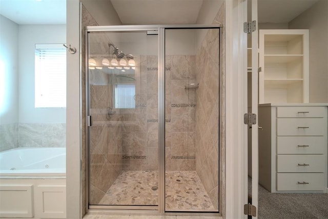 bathroom with separate shower and tub