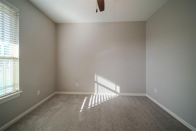 empty room featuring carpet and ceiling fan