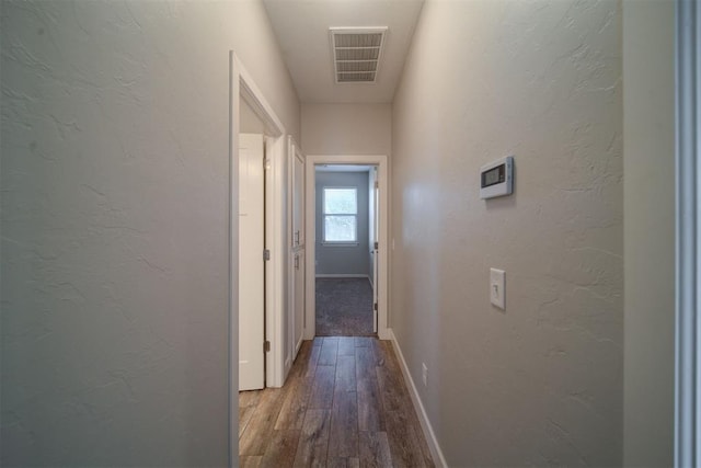 hall featuring wood-type flooring