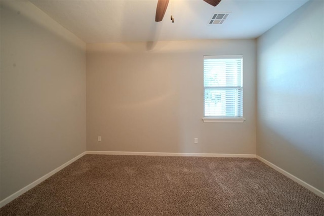 carpeted empty room featuring ceiling fan