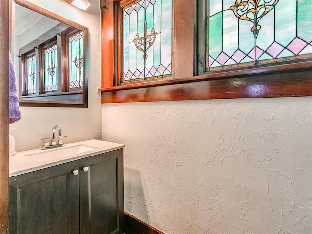 bathroom featuring vanity and crown molding