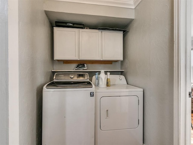 washroom with cabinets and independent washer and dryer